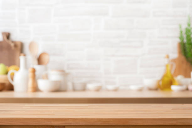 istock Empty wooden table with blurred kitchen at background. Ideal for product display 2158270966