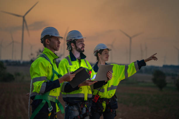 istock Team Engineers men and woman checking and inspecting on construction with sunset sky. people operation. Wind turbine for electrical of clean energy and environment. Industrial of sustainable. 2158272902