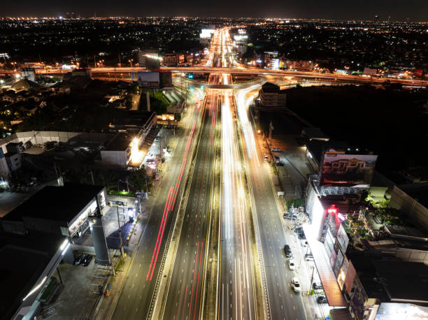 istock Expressway top view, Road traffic an important infrastructure, Drone aerial view fly in circle, traffic transportation, Public transport or commuter city life concept of economic and energ, transport. 2158273993