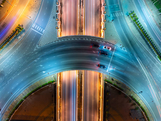istock Expressway top view, Road traffic an important infrastructure, Drone aerial view fly in circle, traffic transportation, Public transport or commuter city life concept of economic and energ, transport. 2158274081