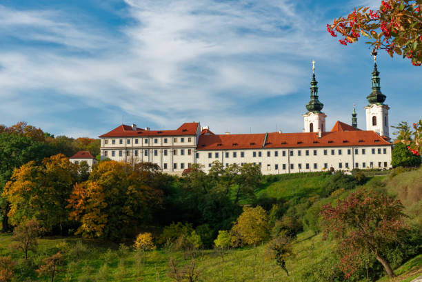 istock Strahov Monastery, a white building with a red roof, situated on a hill in Prague. 2158276041