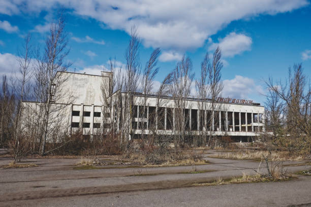 istock An abandoned structure with graffiti, under a blue sky with scattered clouds. The Energetik Palace of Culture is a now abandoned multifunctional palace of culture in Pripyat. 2158276300