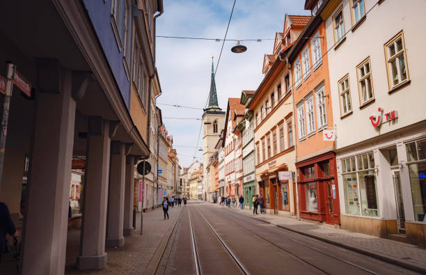 Erfurt, Germany - May 21, 2023: narrow street with tram tracks in the direction of the main square of the city