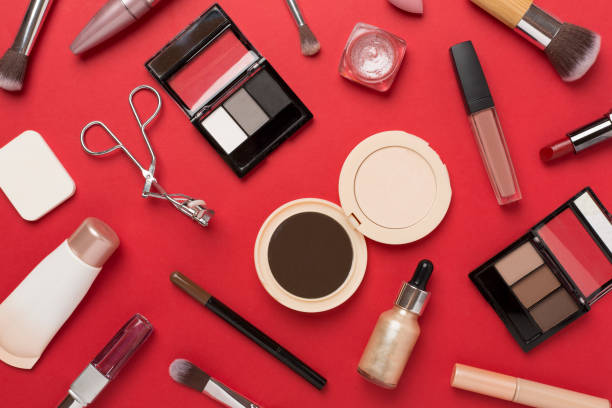 istock Flat lay with makeup products and tools on color background 2158278449