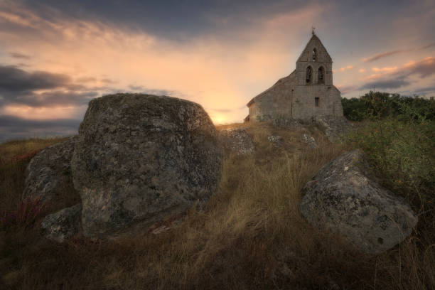 Sunrise at the Romanesque church of San Martin and medieval necropolis in Aguilar de Campoo, Palencia