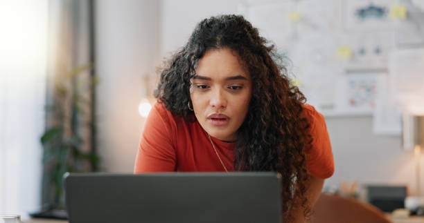istock Female student, laptop and assignment for reading, education and understand details in dormitory. Girl, college research and thesis for studying, planning and project instructions on campus residence 2158280009