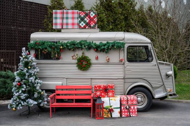 istock Trailer decorated with a wreath and fir branches for Christmas. 2158283943
