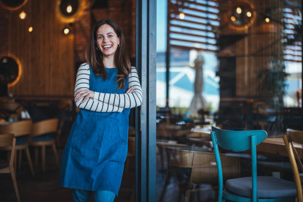 istock Smiling Female Bartender in Coffee Shop 2158284993