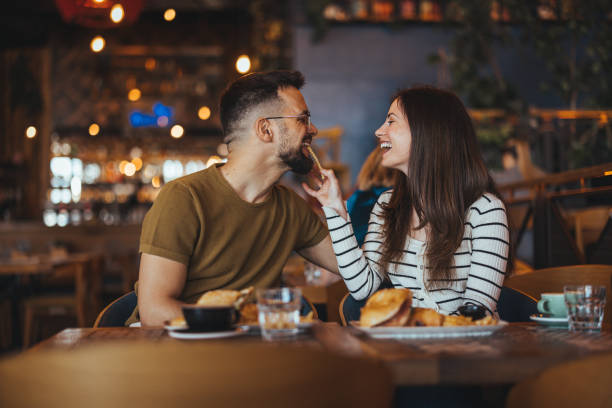 istock Smiling Couple Enjoying Meal at Cozy Eatery 2158285092