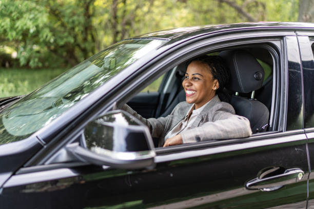istock Businesswoman driving a car 2158285107