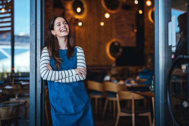 istock Friendly Female Barista in Coffee Shop 2158285109