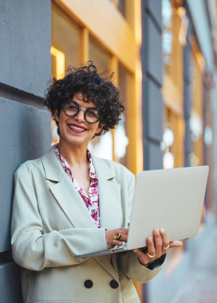 istock Hispanic Businesswoman Working Outdoors with Laptop 2158285129