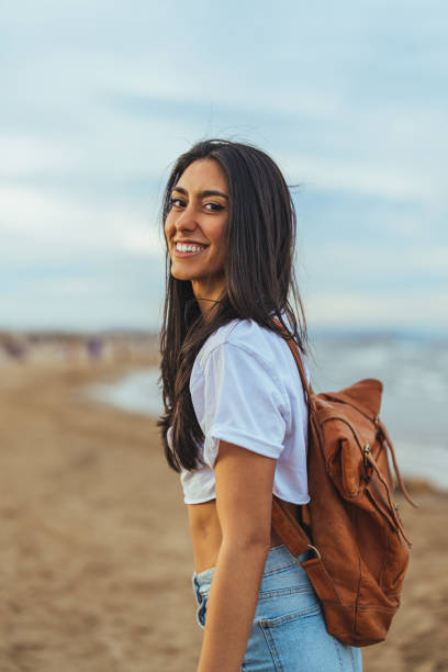 istock Joyful Hispanic Woman Enjoying Seaside Escape 2158285390