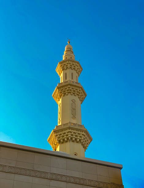 istock Tall Minaret Against Clear Blue Sky 2158286304