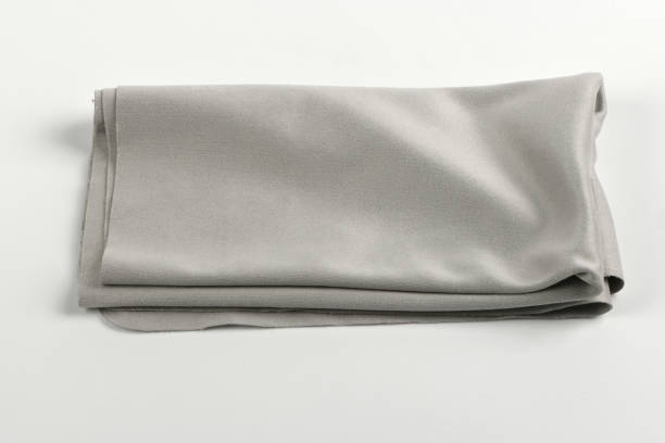 Glass cleaning black cloth napkin, composition isolated on grey background. High resolution photo. Full depth of field.