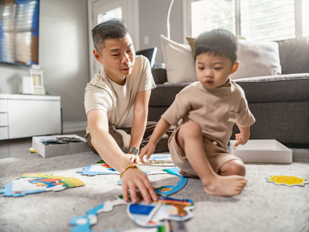 istock Young Korean Father at Home playing with toddler son 2158287819