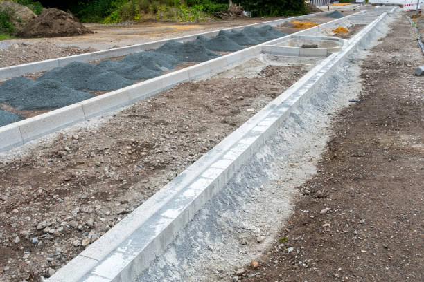 istock a new road with carriageway and sidewalk is being built 2158288350