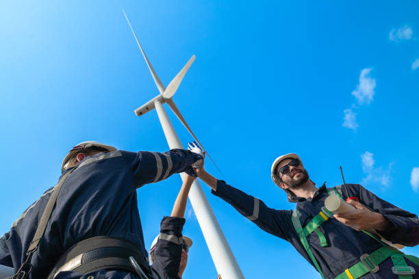 istock The engineering team joins hands with confidence after completing the inspection of the wind turbine construction site to produce clean electricity and help with sustainability and reduce pollution. 2158288606