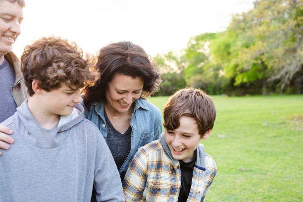 istock Parents smile and laugh with sons 2158291468