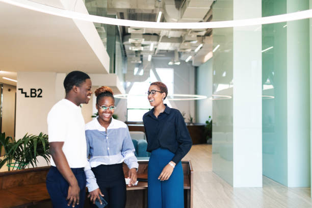 istock Three black colleagues talking and relaxing at the modern office 2158293286