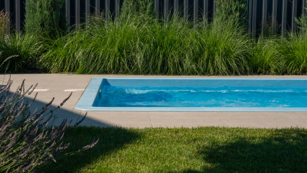 istock In the home pool, the counter-current system is turned on, making it an excellent place to swim in the backyard 2158295737