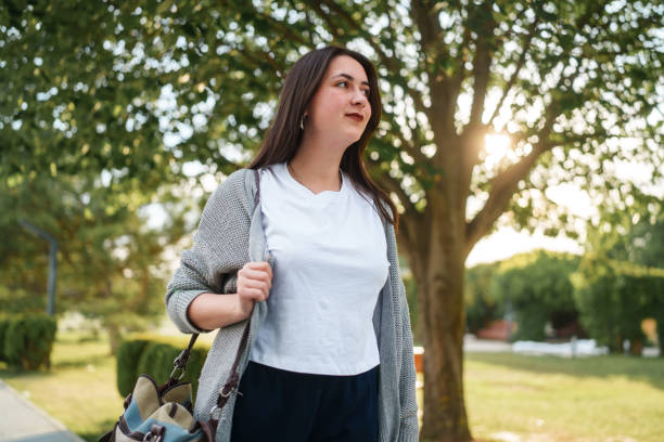 istock A simple day of a university student is walking in park 2158295739