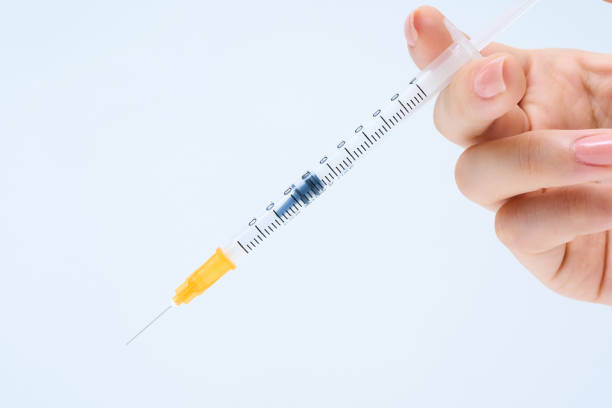 male doctor holding a bottle of medicine for vaccination, for injection
