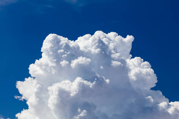 istock Closeup, cumulus clouds. Blue sky in background. 2158299774
