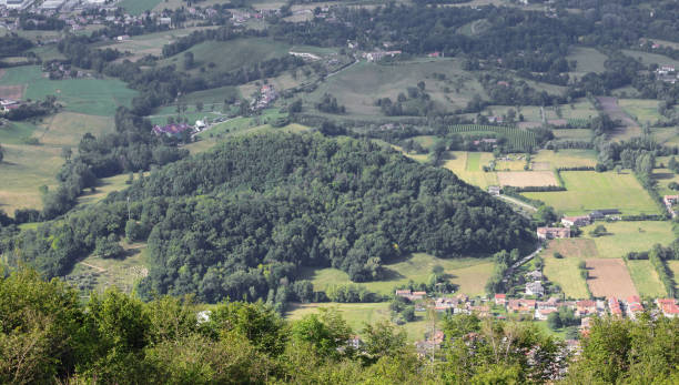 istock Panoramic view from a hill with many trees and some villages 2158301246