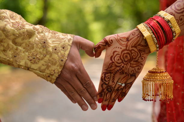 istock Traditional indian wedding ceremony, They draw hearts for each other 2158301983