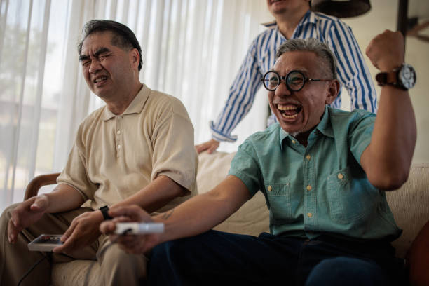 istock Friends Enjoying Playing Video Games 2158302185