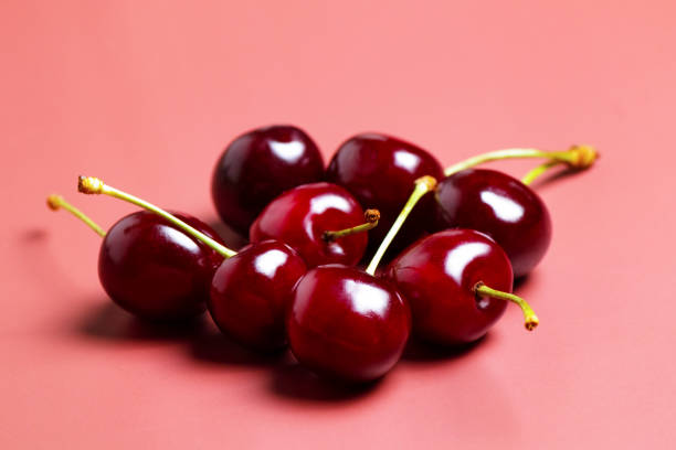 istock Sweet juicy cherries on a pink background 2158302414