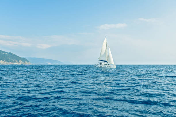istock Sailboat with white sails in blue Mediterranean sea. 2158302502