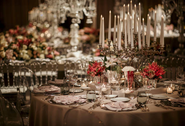 istock Beautiful table setting for family Christmas dinner. Cozy atmosphere, candlelight on tall candelabras. stock photo 2158305470