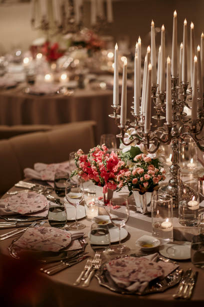 istock Beautiful table setting for family Christmas dinner. Cozy atmosphere, candlelight on tall candelabras. stock photo 2158305491