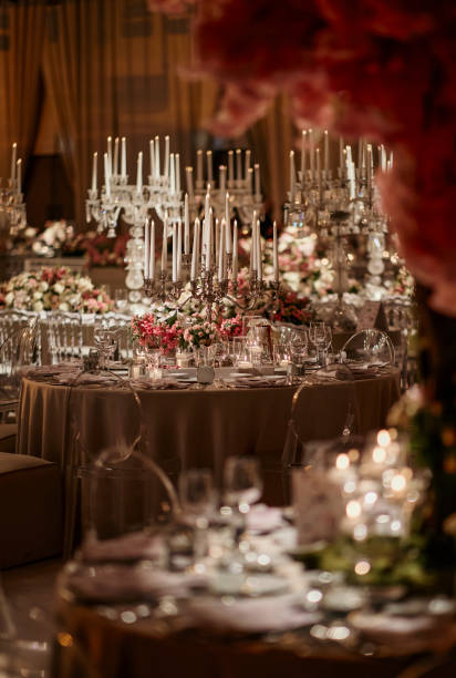 istock Beautiful table setting for family Christmas dinner. Cozy atmosphere, candlelight on tall candelabras. stock photo 2158305497