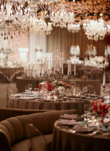 Beautiful table setting for family Christmas dinner. Cozy atmosphere, candlelight on tall candelabras. stock photo