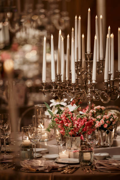 istock Beautiful table setting for family Christmas dinner. Cozy atmosphere, candlelight on tall candelabras. stock photo 2158305579
