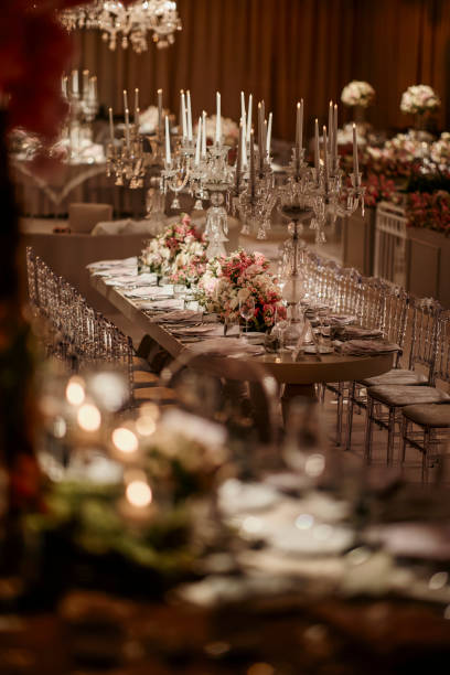 istock Beautiful table setting for family Christmas dinner. Cozy atmosphere, candlelight on tall candelabras. stock photo 2158305587