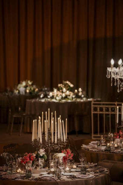 istock Beautiful table setting for family Christmas dinner. Cozy atmosphere, candlelight on tall candelabras. stock photo 2158305589