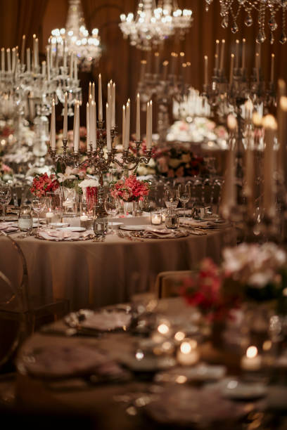 istock Beautiful table setting for family Christmas dinner. Cozy atmosphere, candlelight on tall candelabras. stock photo 2158305597