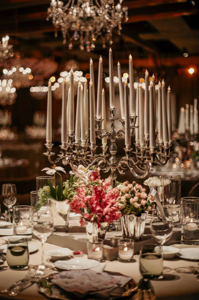 istock Beautiful table setting for family Christmas dinner. Cozy atmosphere, candlelight on tall candelabras. stock photo 2158305622