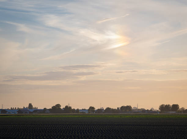 istock Mock sun over an agricultural landscape 2158307043