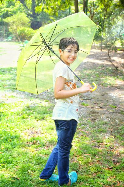 istock Kids enjoying rainy season 2158307091