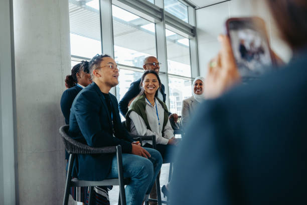 istock Male speaker engaging with audience during business event while being filmed 2158308080