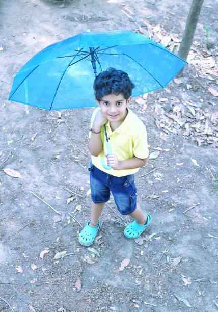 istock Kids enjoying rainy season 2158308478