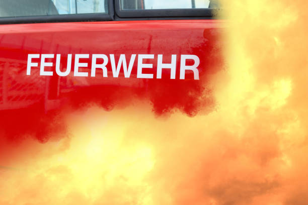 red fire Car, fire department in german, dramatic orange fire flame, voluntary fire brigade in Germany, volunteering concept, fire fighting and community assistance