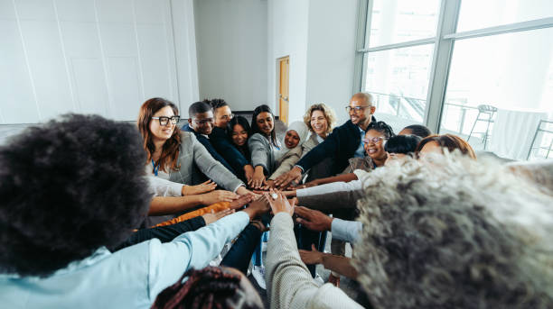 istock Diverse team of professionals collaborating together and solving problems in modern office 2158313184