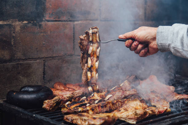 Mature man doing a bbq. Asado in Argentina.