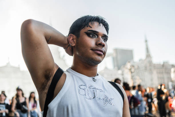 istock Young man contemplating on LGBTQIA pride parade 2158322137
